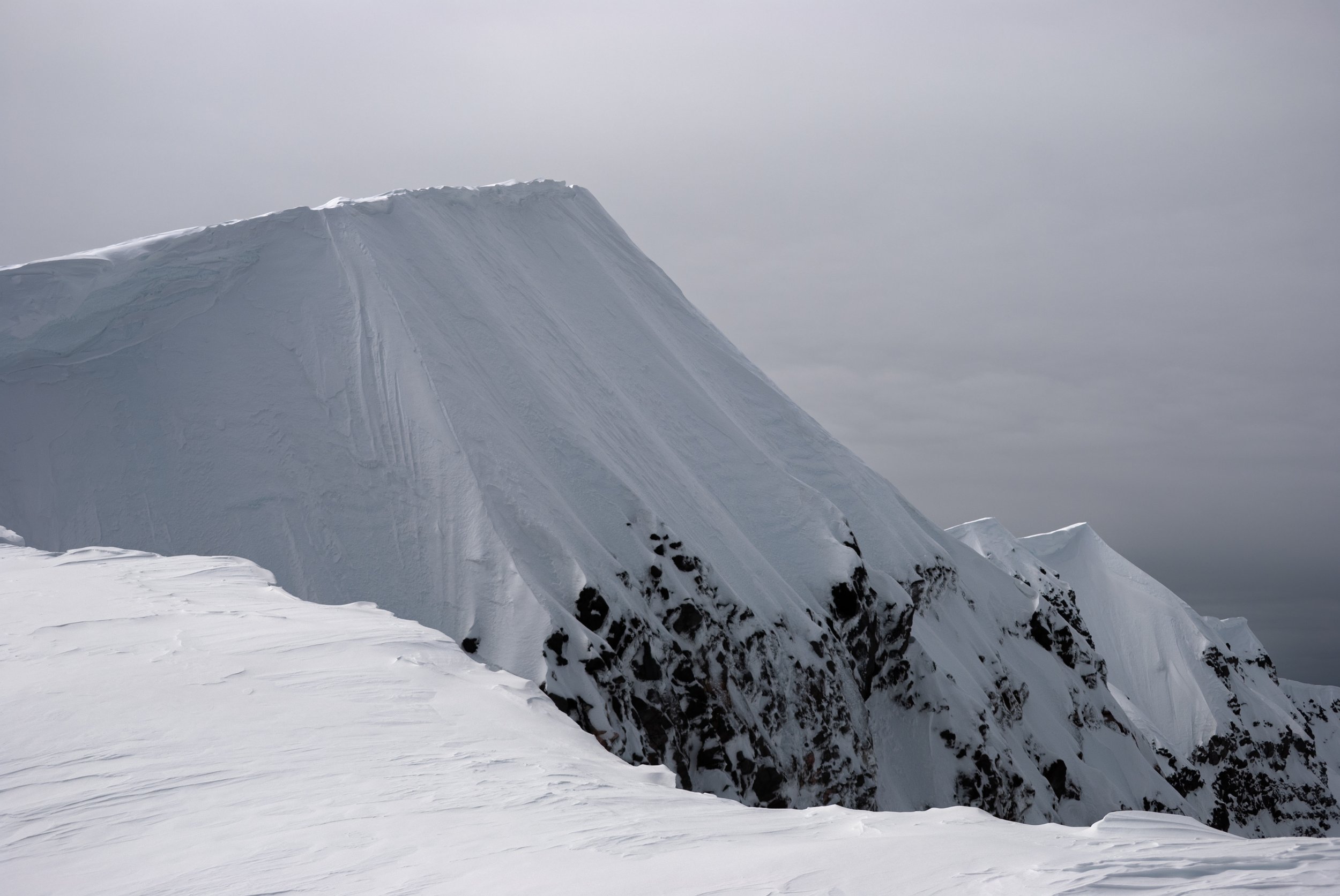 Snowy summit rim ridge