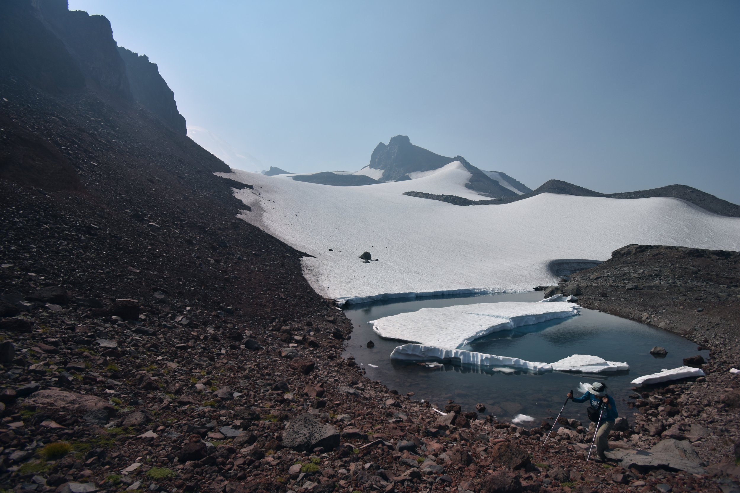 Ice-locked lake with hiker
