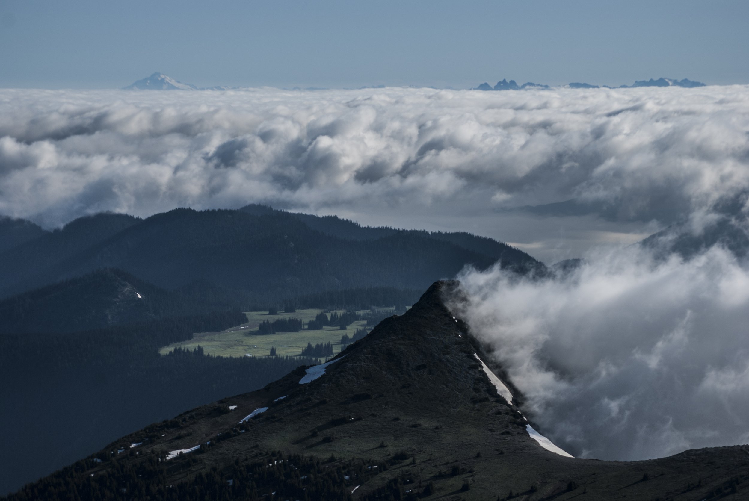 Ridges and peaks with pooling clouds